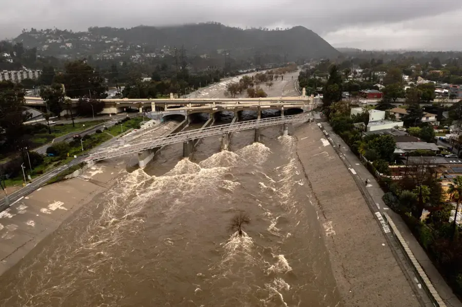 Los Angeles River running high in its concrete channel during a winter storm