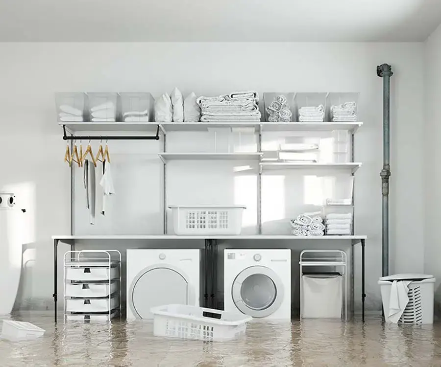 Laundry room flooded by a washer supply hose leak in South Gate