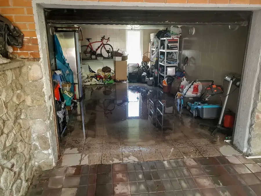 Water across a concrete garage floor in South Gate